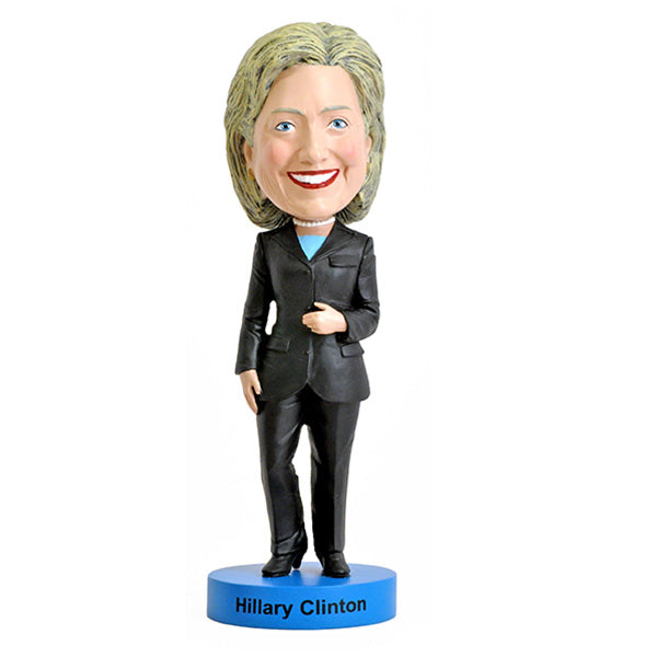 Hillary Clinton 2016 bobblehead, standing approximately 8 inches tall, capturing her likeness in vibrant detail, displayed on a shelf.