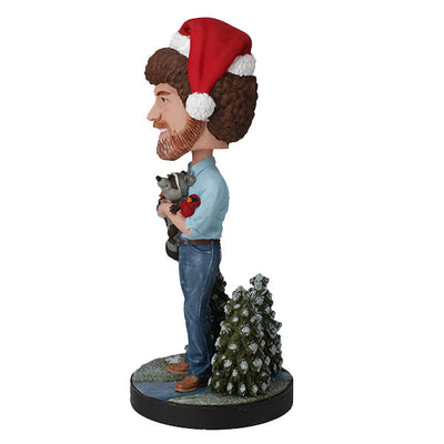 Holiday Bob Ross Bobblehead featuring Bob Ross in a winter sweater, approximately 8 inches tall, smiling joyfully.