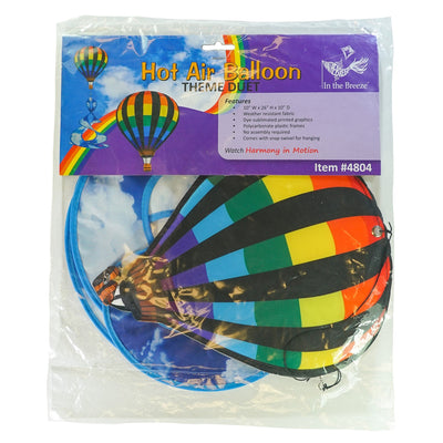 Colorful Hot Air Balloon Theme Duet spinner hanging outdoors, featuring a vibrant hot air balloon design that spins beautifully in the wind.