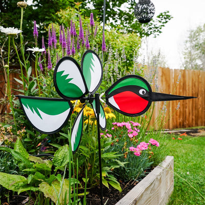 Hummingbird Baby Spinner with colorful design displayed outdoors, showcasing a vibrant baby hummingbird spinning in the garden.