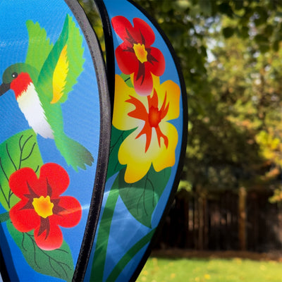 Hummingbird Flowers Hot Air Balloon spinner with colorful flower and hummingbird designs, spinning gracefully in an outdoor setting.
