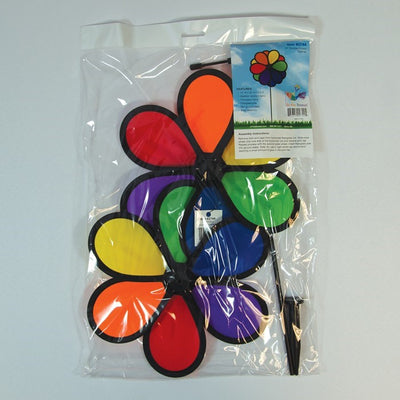 Alt text: "10-inch double flower spinner with two vibrant rainbow flower wheels rotating in opposite directions, displayed in a garden setting.