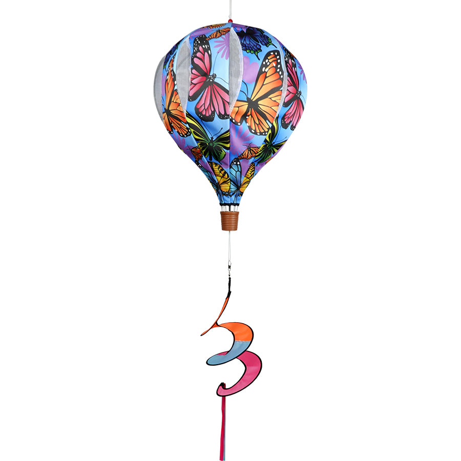 Alt Text: 22 in. Pop-Open Hot Air Balloon featuring natural butterflies displayed in a garden, spinning beautifully in the wind.