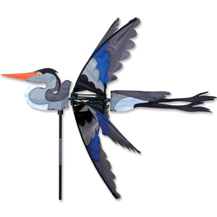 Alt text: "30 in. Great Blue Heron Spinner displaying dynamic movement in a lush garden setting, showcasing detailed craftsmanship and vibrant colors.