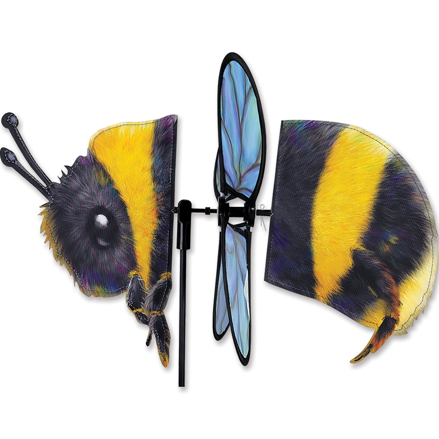 Alt Text: Petite Spinner - Bee in a vibrant garden setting, showcasing its colorful design and pre-glued wings, spinning gracefully in the breeze.