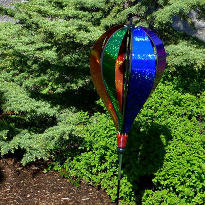 **Alt Text** Rainbow Glitter 6-Panel Hot Air Balloon Ground Spinner displaying vibrant colors while spinning gracefully in a sunny garden setting.