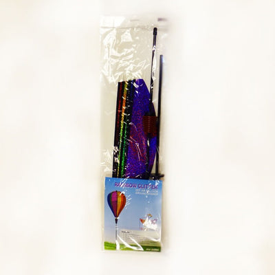 **Alt Text** Rainbow Glitter 6-Panel Hot Air Balloon Ground Spinner displaying vibrant colors while spinning gracefully in a sunny garden setting.