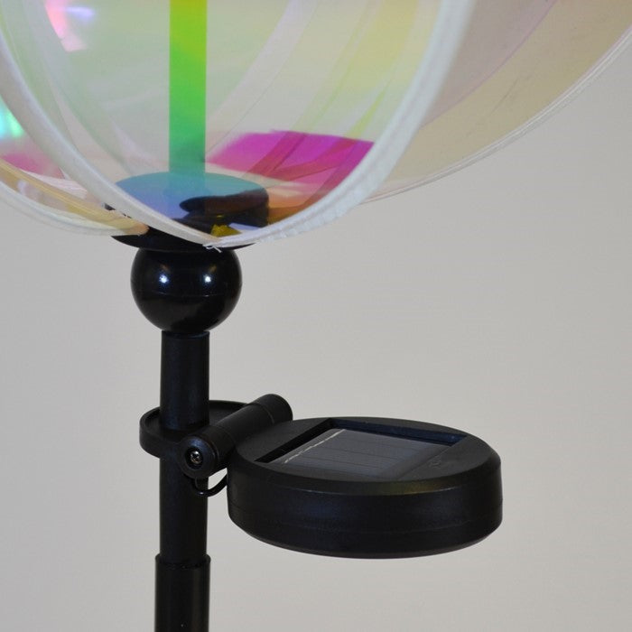 Iridescent 11-inch garden gazing ball spinner with solar light showcasing vibrant colors in an outdoor setting, perfect for garden decor.