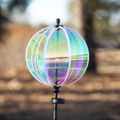 Iridescent 11-inch garden gazing ball spinner with solar light showcasing vibrant colors in an outdoor setting, perfect for garden decor.