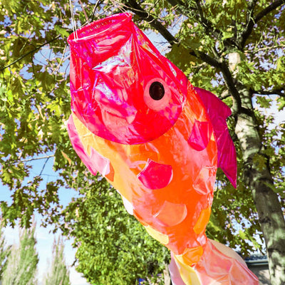 48 inch iridescent hot damsel fish windsock featuring colorful shimmering scales and an applique design hanging gracefully outdoors.
