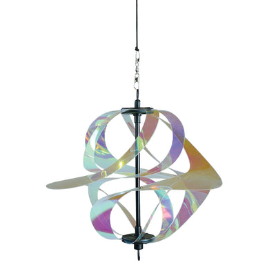 Iridescent Vortex Spinner with Mylar spirals suspended outdoors, reflecting sunlight in vibrant colors within a garden setting.