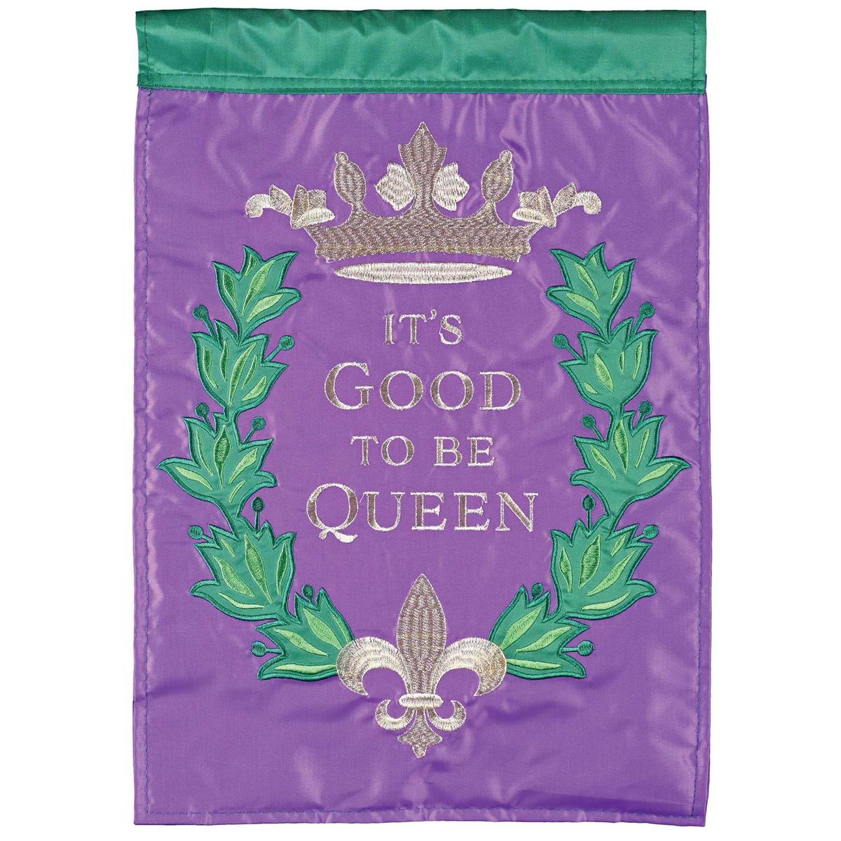 It Is Good To Be Queen double applique banner flag, measuring 29x42 inches, beautifully displayed on a flagpole in a garden setting.