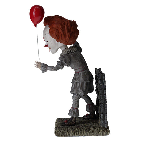 IT: Pennywise Bobblehead made from heavyweight hand-painted polyresin, depicting a menacing Pennywise from IT CHAPTER TWO in a detailed design.