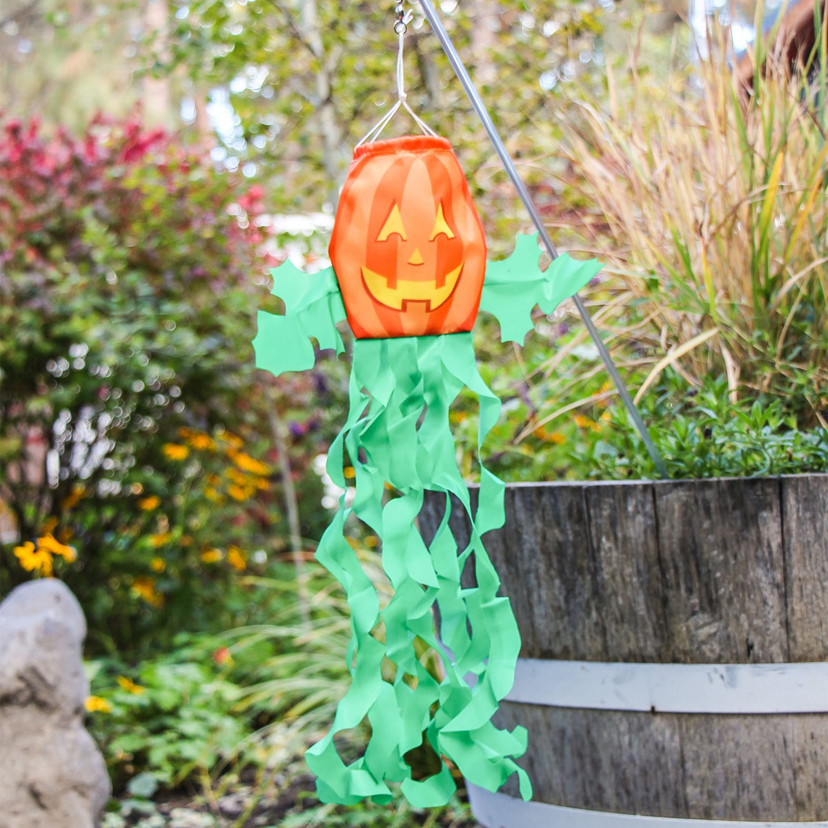 Jack O' Lantern on a Wand - colorful pumpkin attached to a no-shatter wand, ideal for Halloween decorations and children's play.