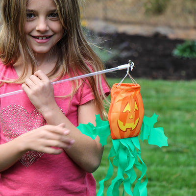 Jack O' Lantern on a Wand - colorful pumpkin attached to a no-shatter wand, ideal for Halloween decorations and children's play.