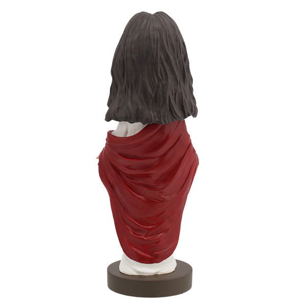 Hand-painted Jesus Christ Bobblehead made of heavyweight polyresin, showcasing intricate details, displayed indoors on a shelf.