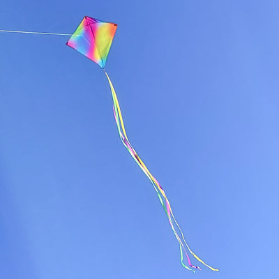 The Jewel 30" Diamond Kite features a vibrant color blend with a diamond shape, perfect for outdoor flying, complete with colorful tails for added fun.