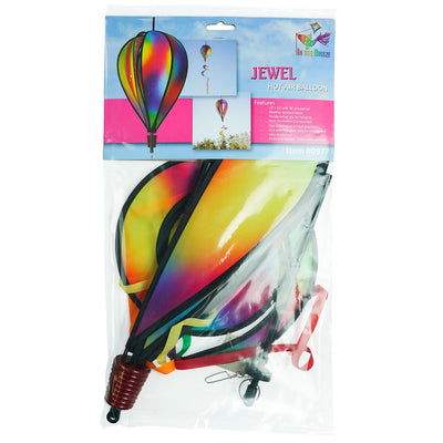 Jewel 6-Panel Hot Air Balloon spinner featuring a rainbow design, spinning gently in the breeze against a clear blue sky outdoors.