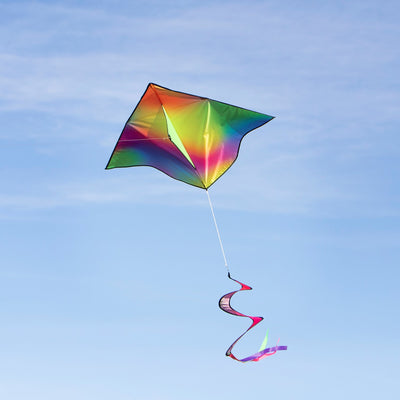 Jewel Delta with Spinning Tail kite featuring vibrant tie dye design in the sky during a sunny day, showcasing a fun outdoor activity.