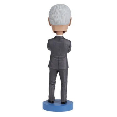 Joe Biden bobblehead standing over 8 inches tall, hand-painted with authentic details, displayed on a colorful shelf against a neutral background.