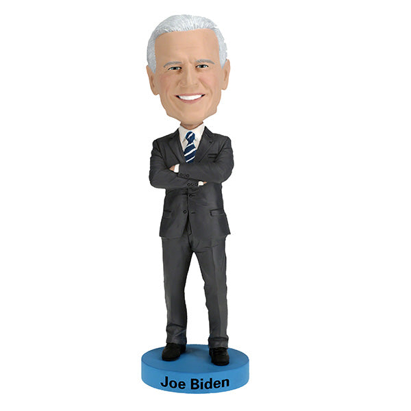 Joe Biden bobblehead standing over 8 inches tall, hand-painted with authentic details, displayed on a colorful shelf against a neutral background.