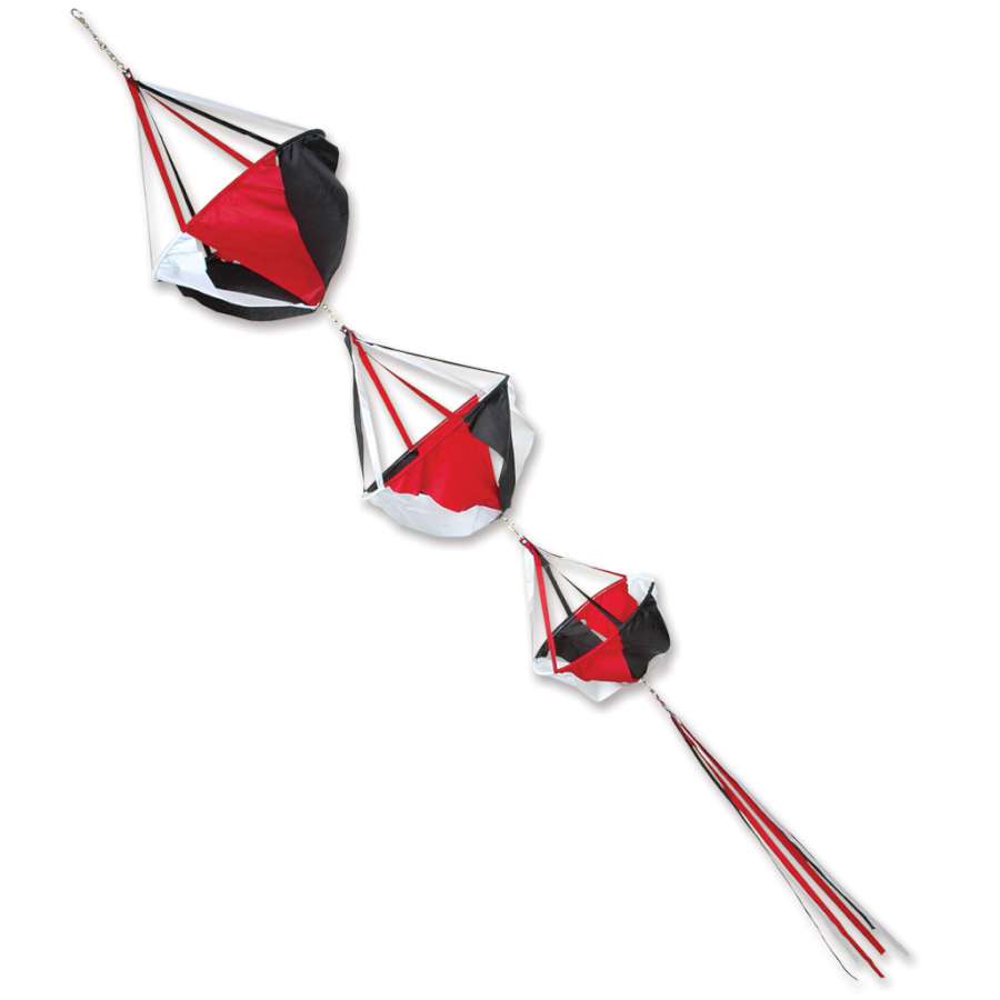 Jumbo Spinnie Set - Tecmo featuring colorful spinners with streamer tails caught in a gentle breeze, displayed in a sunny outdoor garden.