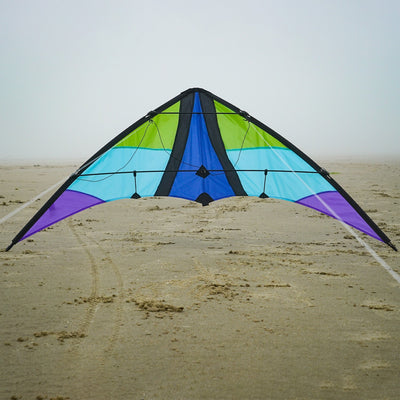 Kai 63' Sport Kite soaring against a bright blue sky, featuring vivid colors and a sleek two-line design ideal for outdoor enthusiasts.