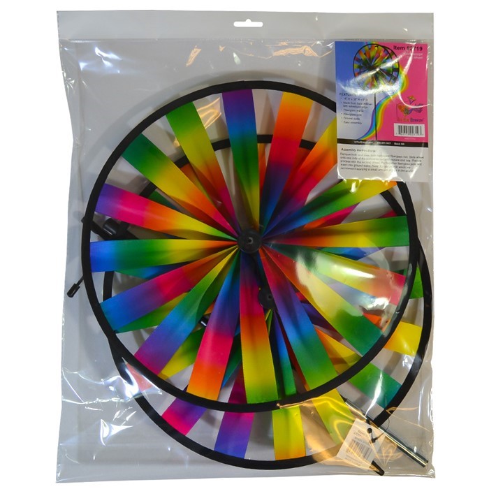 Kaleidoscope Double Wheel Spinner featuring rainbow colors and durable fiberglass frames, spinning in a garden setting on a sunny day.