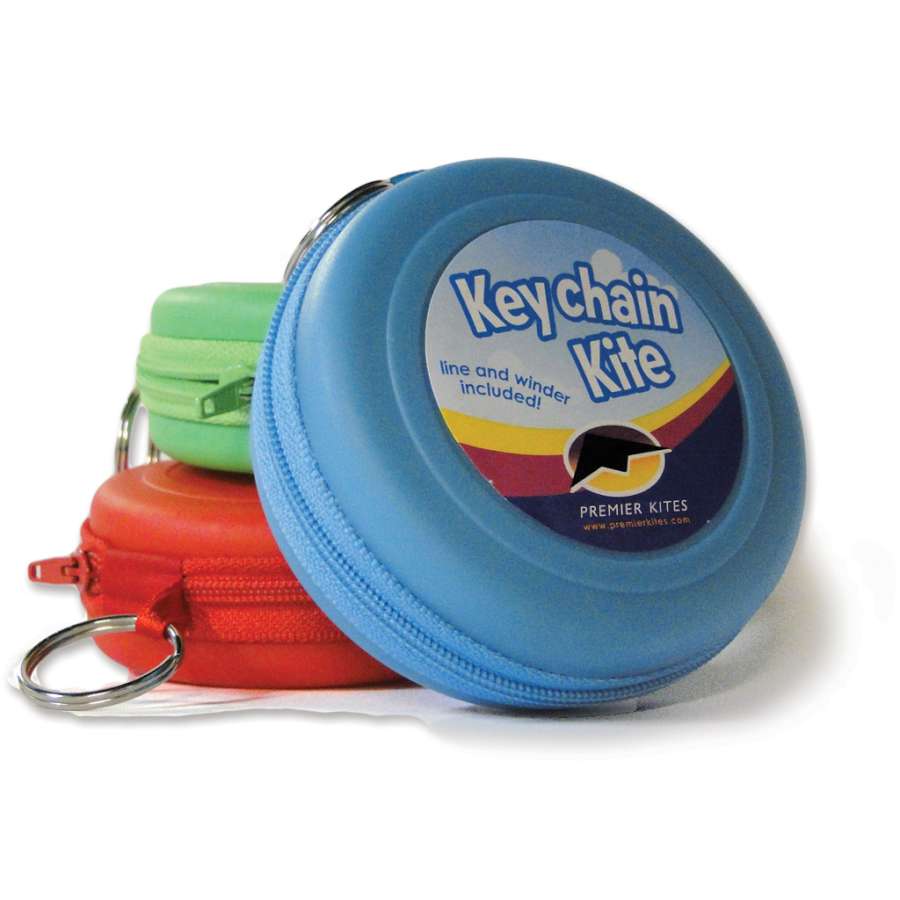 Keychain Kite - Skull & Bones displayed in a bright outdoor setting, showcasing its colorful fabric and compact design ready for flying.