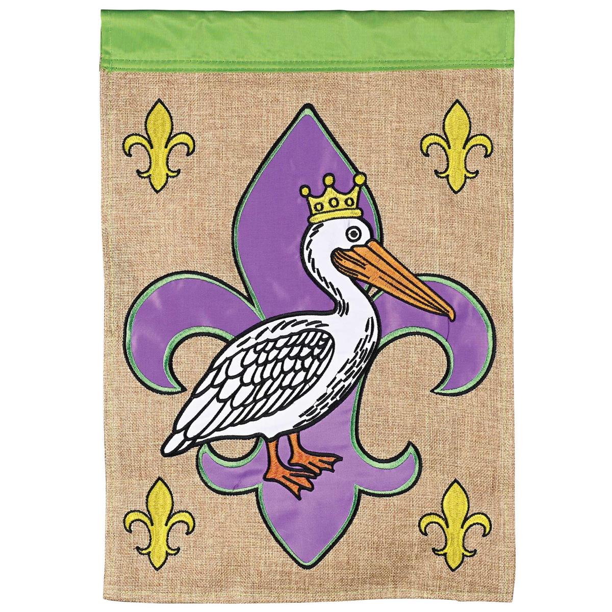King Pelican Fleur-De-Lis Banner Flag featuring embroidered detail, displayed outdoors in a garden setting, measuring 29x42 inches.