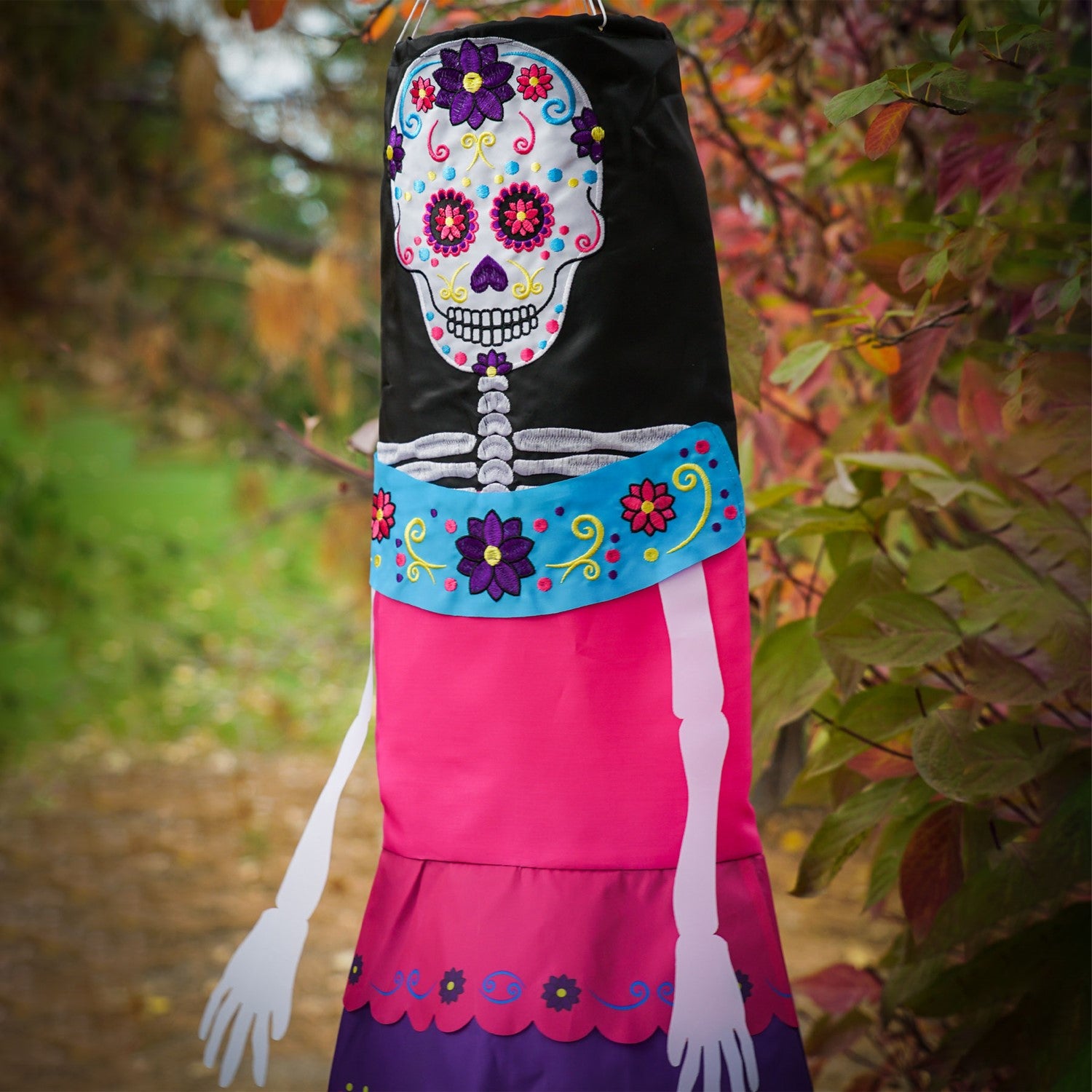 La Catrina 40-inch Breeze Buddy colorful windsock featuring sugar skull design with free-flowing arms and legs, perfect for outdoor Halloween decor.