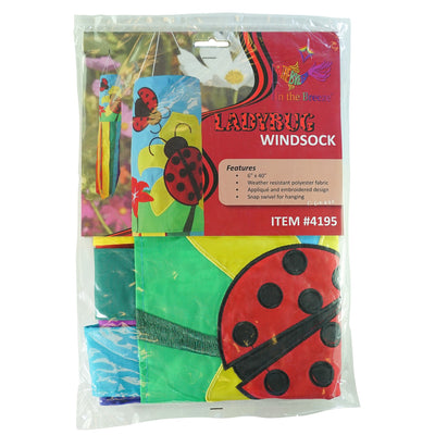A stunning Ladybug Flower 40" windsock featuring vibrant colors and detailed appliqued graphics, fluttering gracefully with eight coordinating tails.