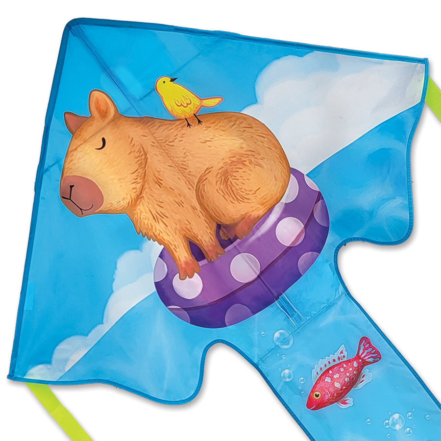 Large Easy Flyer Kite - Capybara measuring 46x90 inches soaring in the sky on a sunny day, showcasing its vibrant design and effortless flying ability.