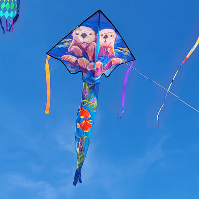 Large Easy Flyer Kite featuring sea otters soaring through a blue sky, showcasing its vibrant design and sturdy fiberglass frame.