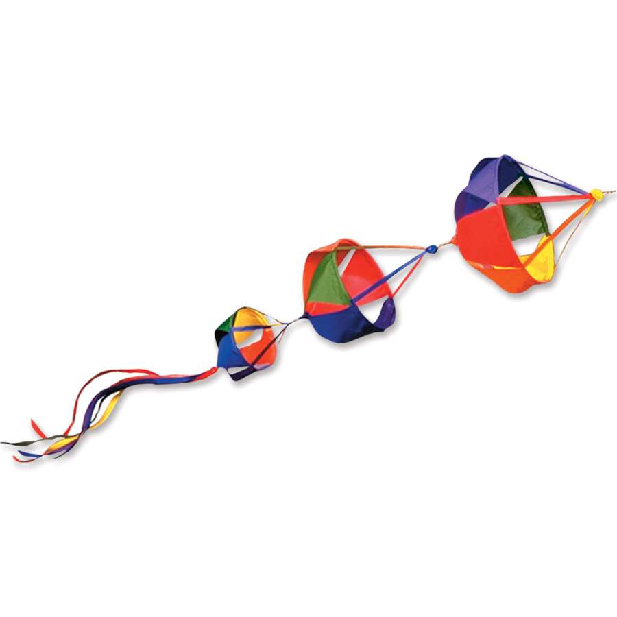 Large Spinnie Set - Rainbow featuring colorful spinning decorations with 24-inch streamer tails, creating a playful and vibrant display in a garden setting.