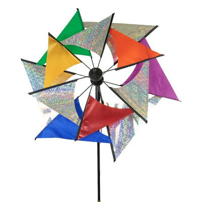 Laser Rainbow Glasshouse Wind Spinner featuring colorful two-wheeled design displayed standing in a garden with blue sky backdrop.