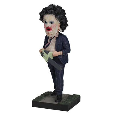 Leatherface - Pretty Woman Mask Bobblehead standing 8 inches tall, featuring detailed human skin mask design in a horror-themed display.
