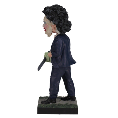 Leatherface - Pretty Woman Mask Bobblehead standing 8 inches tall, featuring detailed human skin mask design in a horror-themed display.