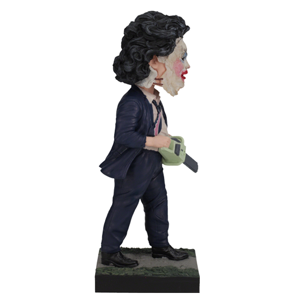 Leatherface - Pretty Woman Mask Bobblehead standing 8 inches tall, featuring detailed human skin mask design in a horror-themed display.