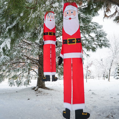 Lil' Santa Claus 3D 40" Windsock with vibrant colors, complete with free-flowing arms and tails, hanging outdoors to celebrate the holiday season.