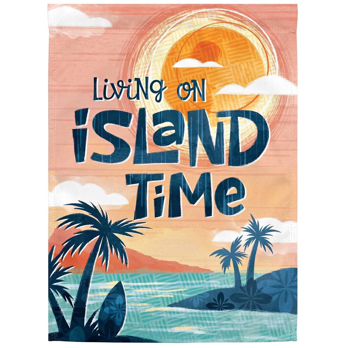 Living On Island Time garden flag featuring bright sublimated design, displayed in a garden setting with sunlight creating a stained glass effect.