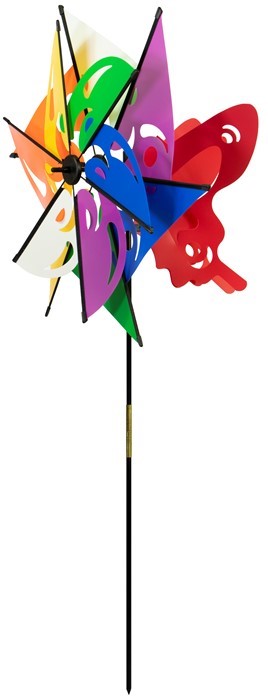 Mardi Gras Ground Spinner with colorful butterfly windsail, positioned in a garden setting, spinning gently in the breeze.