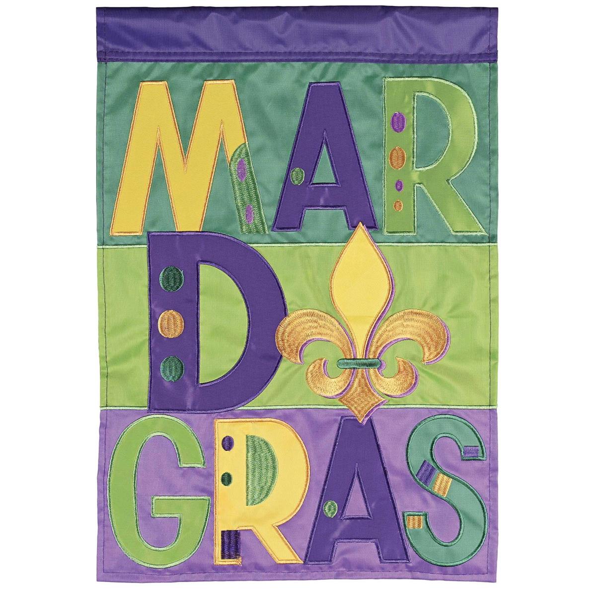 Mardi Gras Polka Dot Fleur Garden Flag featuring colorful polka dots and fleur-de-lis designs displayed on an outdoor flagpole in a vibrant garden setting.