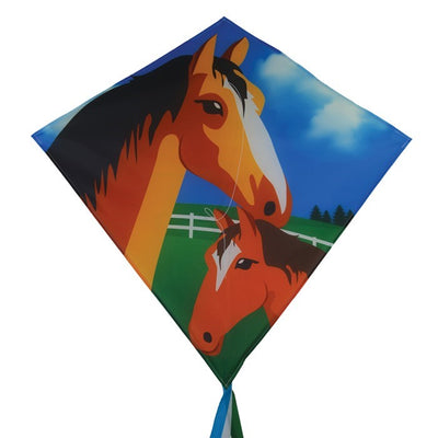 Mare & Foal 30" Diamond Kite soaring in a clear blue sky, featuring colorful graphics and long tails, perfect for outdoor enjoyment.