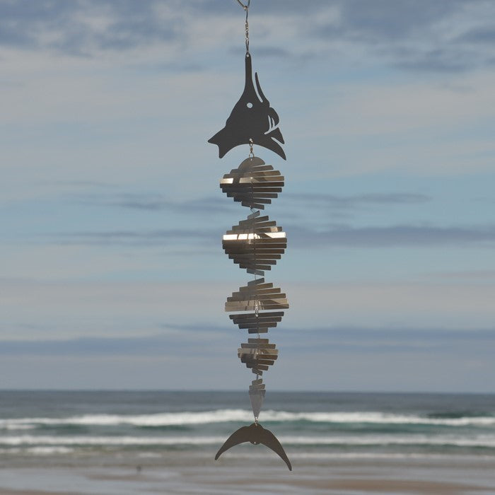 Visually striking Marlin Shimmer Helix Spinner with a helix design and reflective shimmering effect, crafted from durable stainless steel, elegantly displayed outdoors.