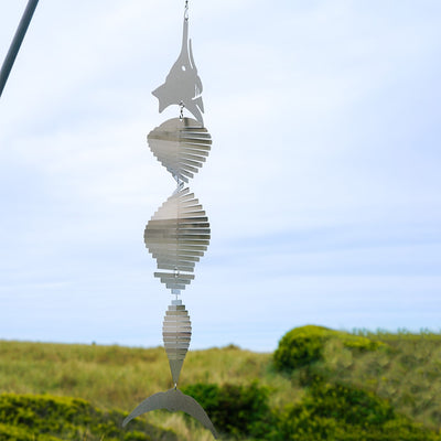Visually striking Marlin Shimmer Helix Spinner with a helix design and reflective shimmering effect, crafted from durable stainless steel, elegantly displayed outdoors.
