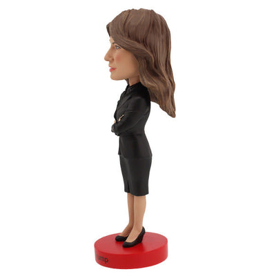 Melania Trump Bobblehead standing 7 inches tall, showcasing intricate details of her elegant attire and signature hairstyle on a display shelf.