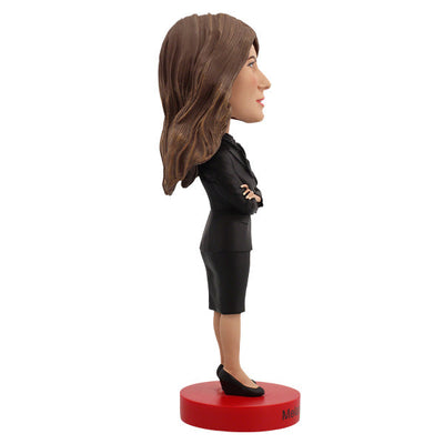 Melania Trump Bobblehead standing 7 inches tall, showcasing intricate details of her elegant attire and signature hairstyle on a display shelf.