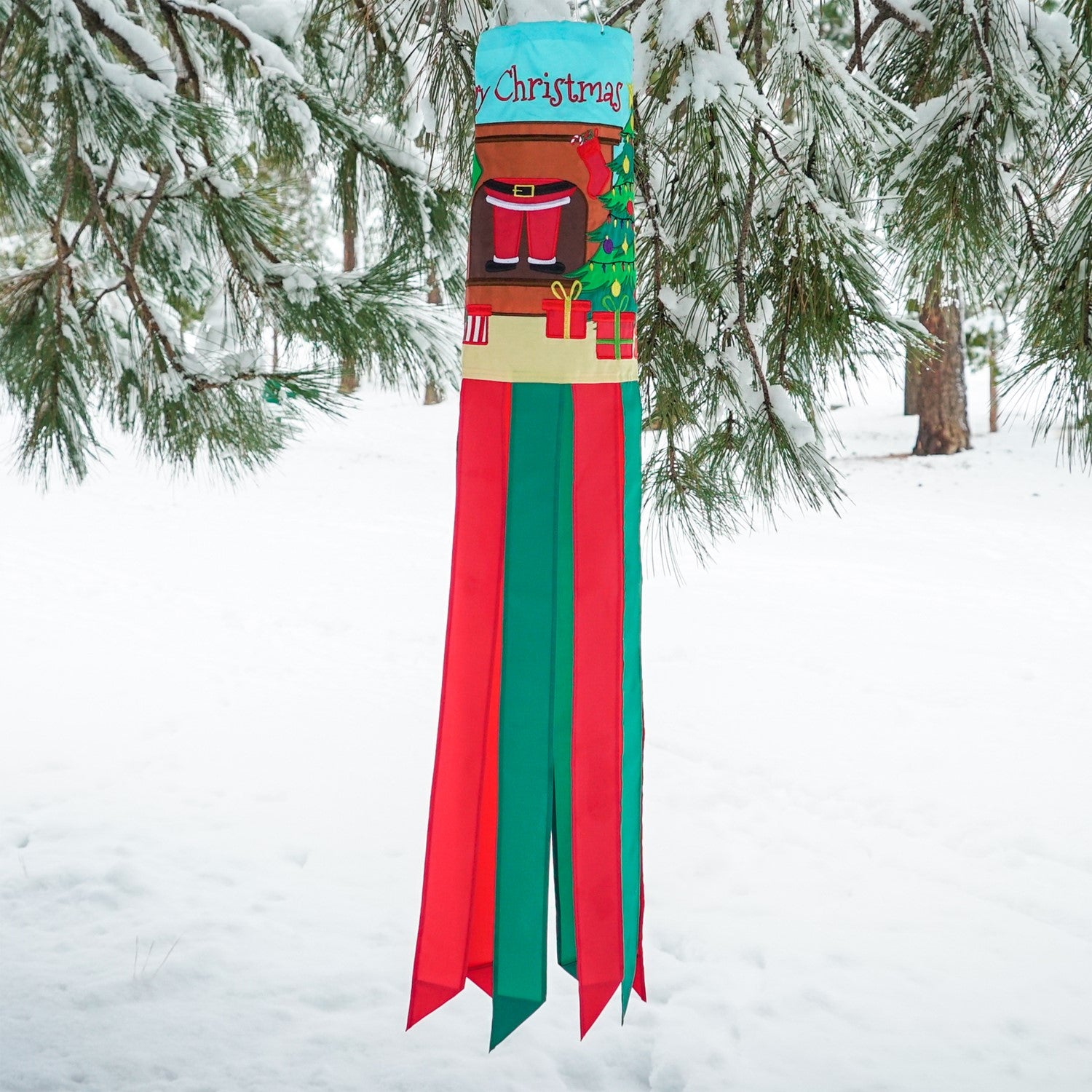 Merry Christmas 40" Windsock featuring a jolly Santa design with colorful tails fluttering in the breeze, ideal for festive outdoor decoration.