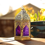 MIDI Purple & Pink Hex Glass Tealight Lantern showcasing colorful hexagonal glass design and antiqued brass frame, illuminated with a tealight candle.